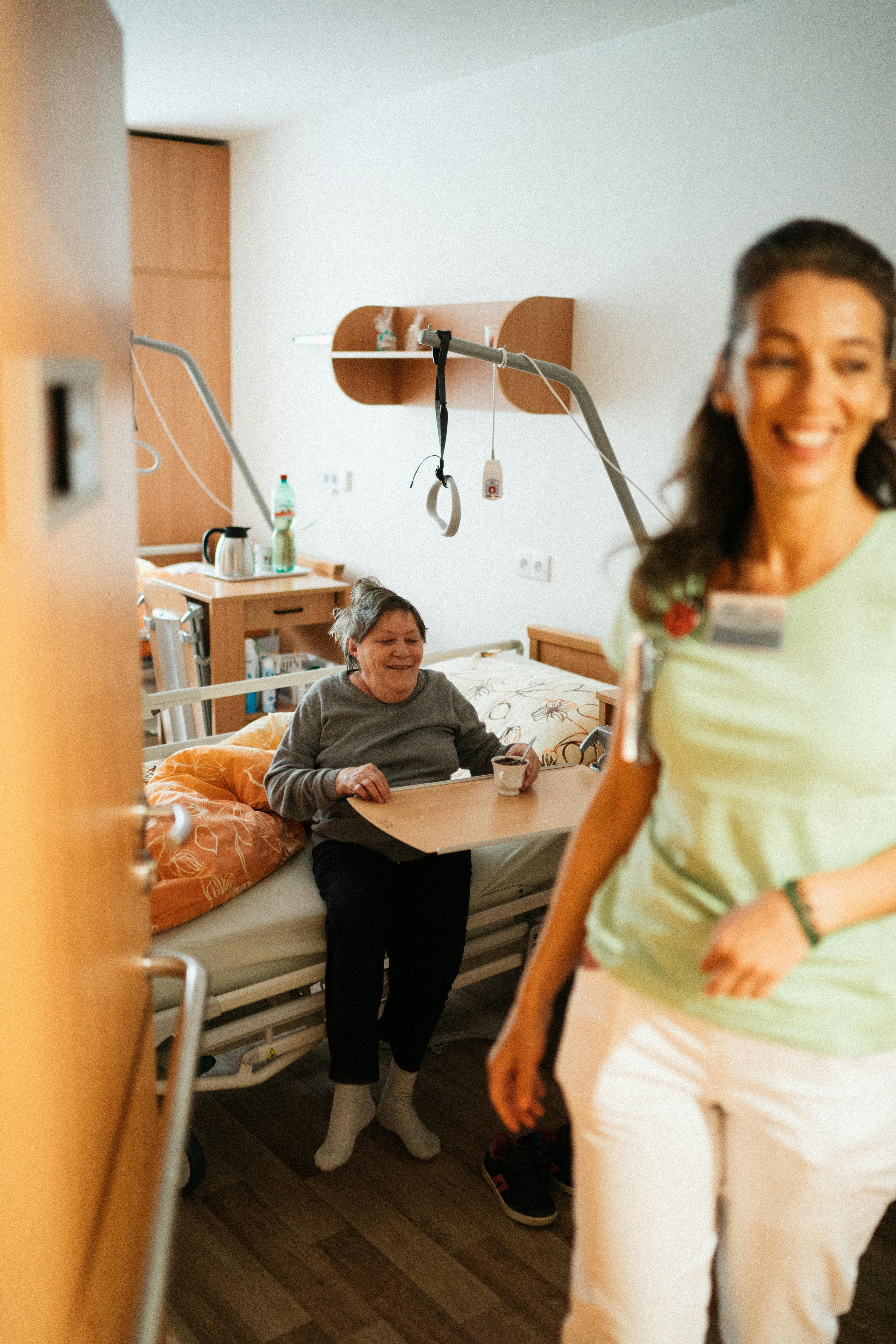 Caregiver supporting a senior in an assisted living community