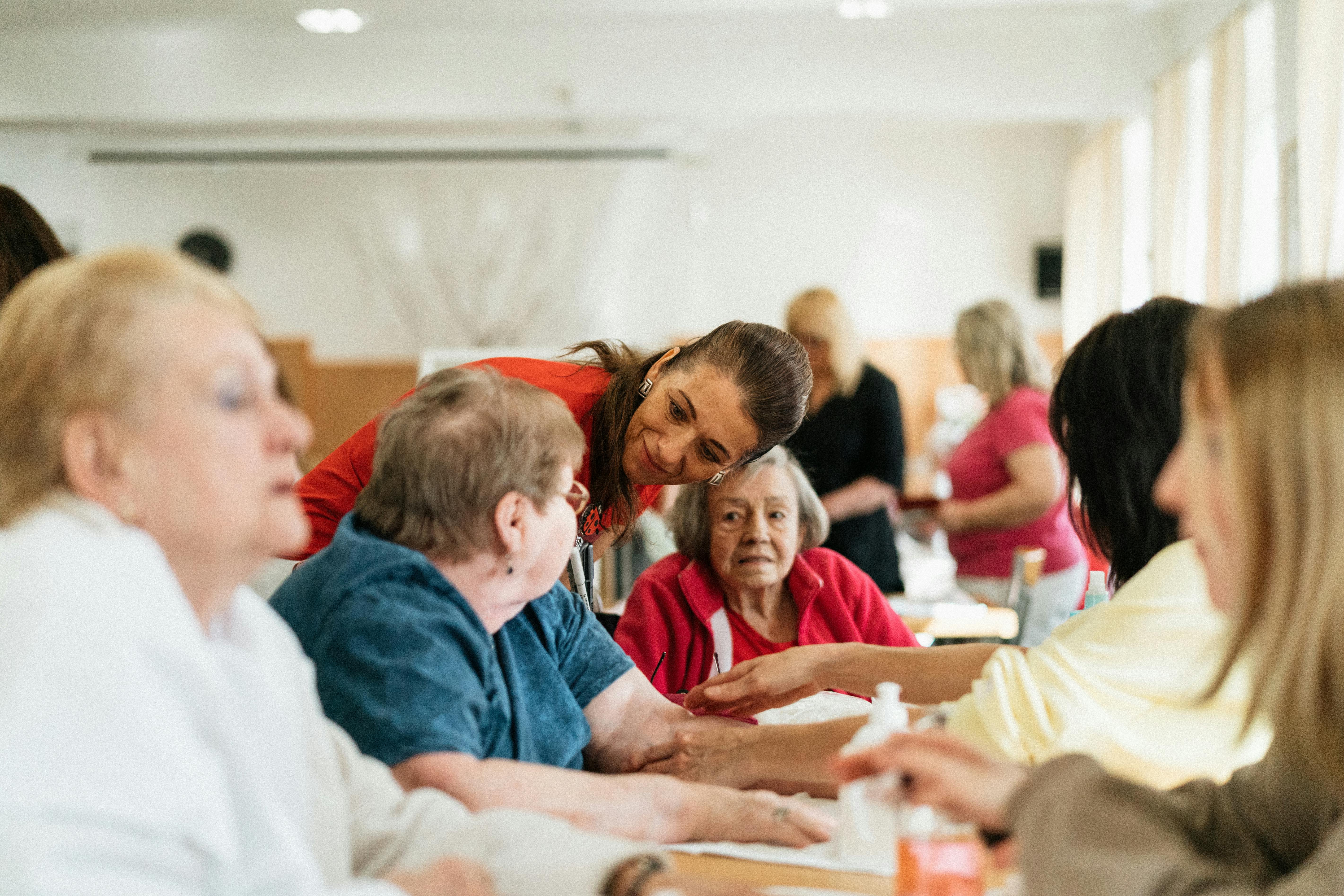 Caregiver assisting senior with daily living activities
