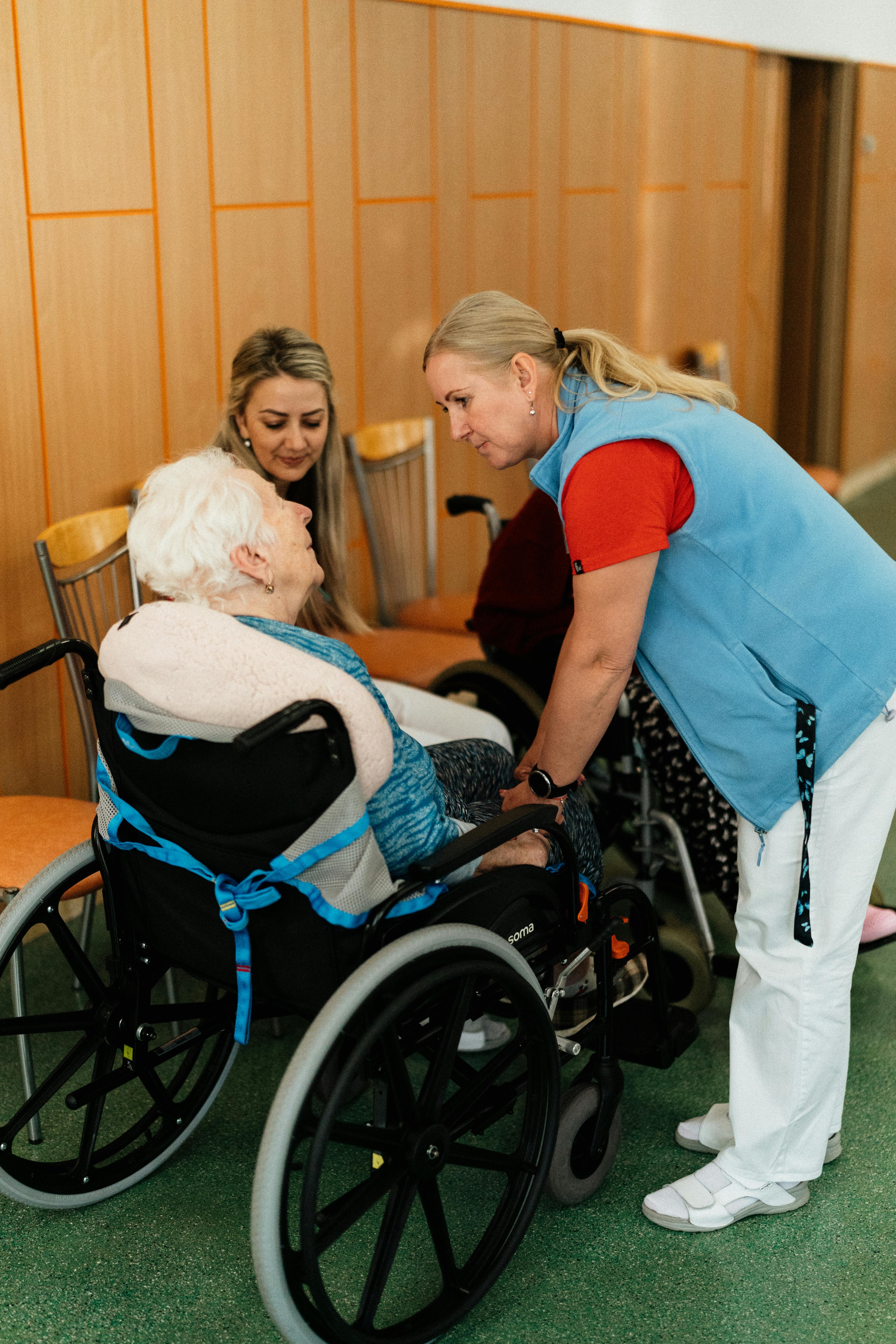 Compassionate caregiver with a senior in a memory care community
